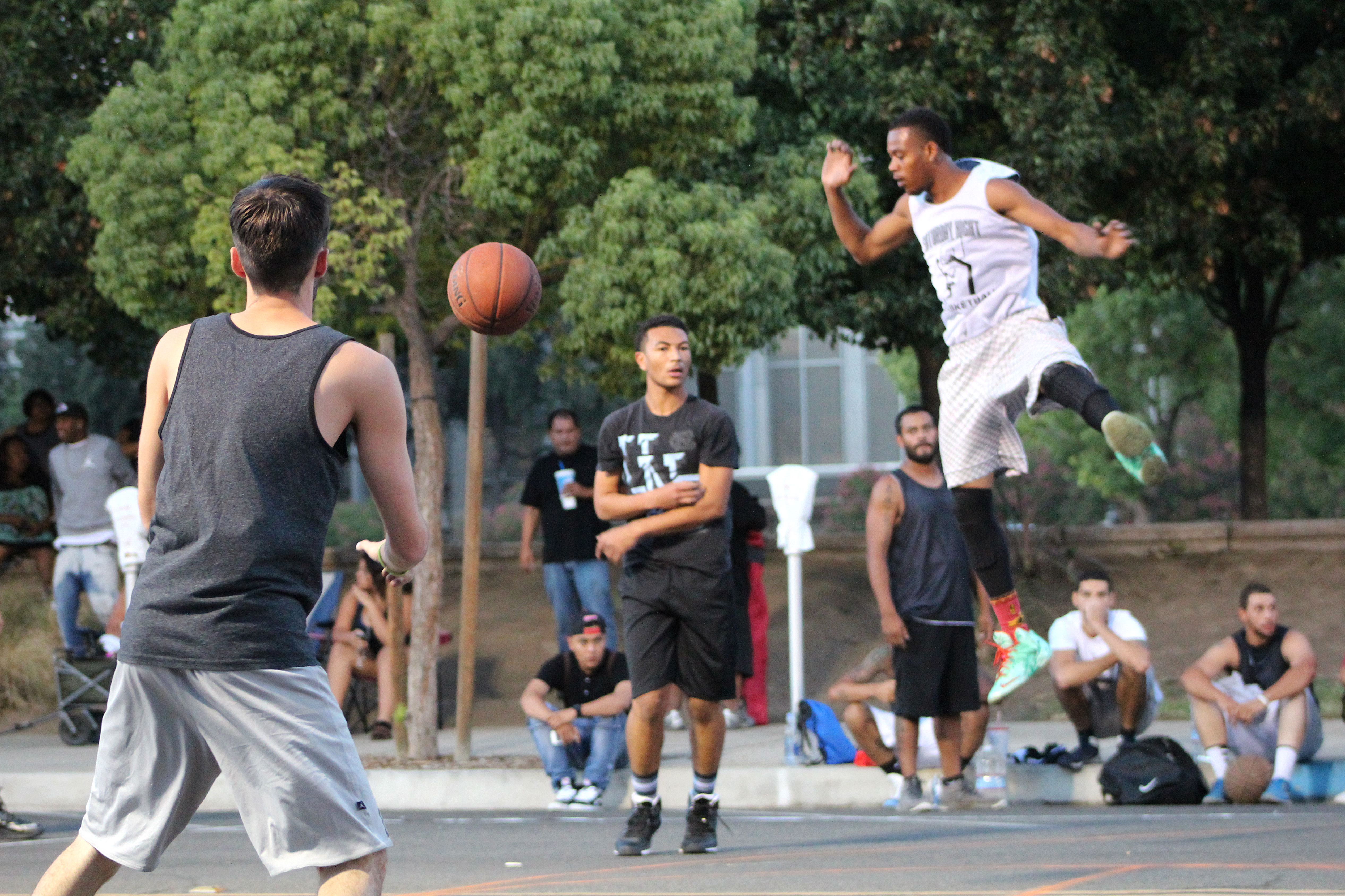 Teams battle it out on the last night of the summer basketball tournament.