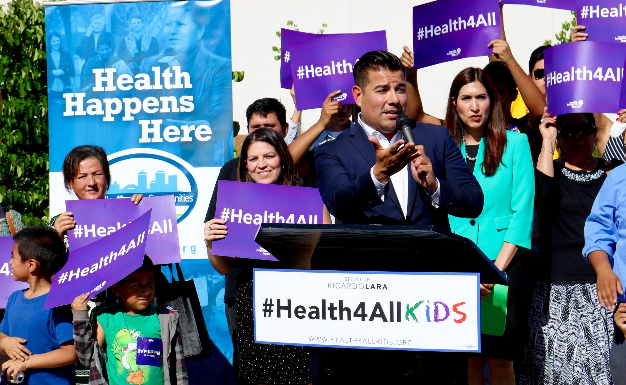 State Sen. Ricardo Lara, D-Bell Gardens, celebrates the beginning of his Health For All Kids Act May 16 in Fresno. Photo by Kody Stoebig