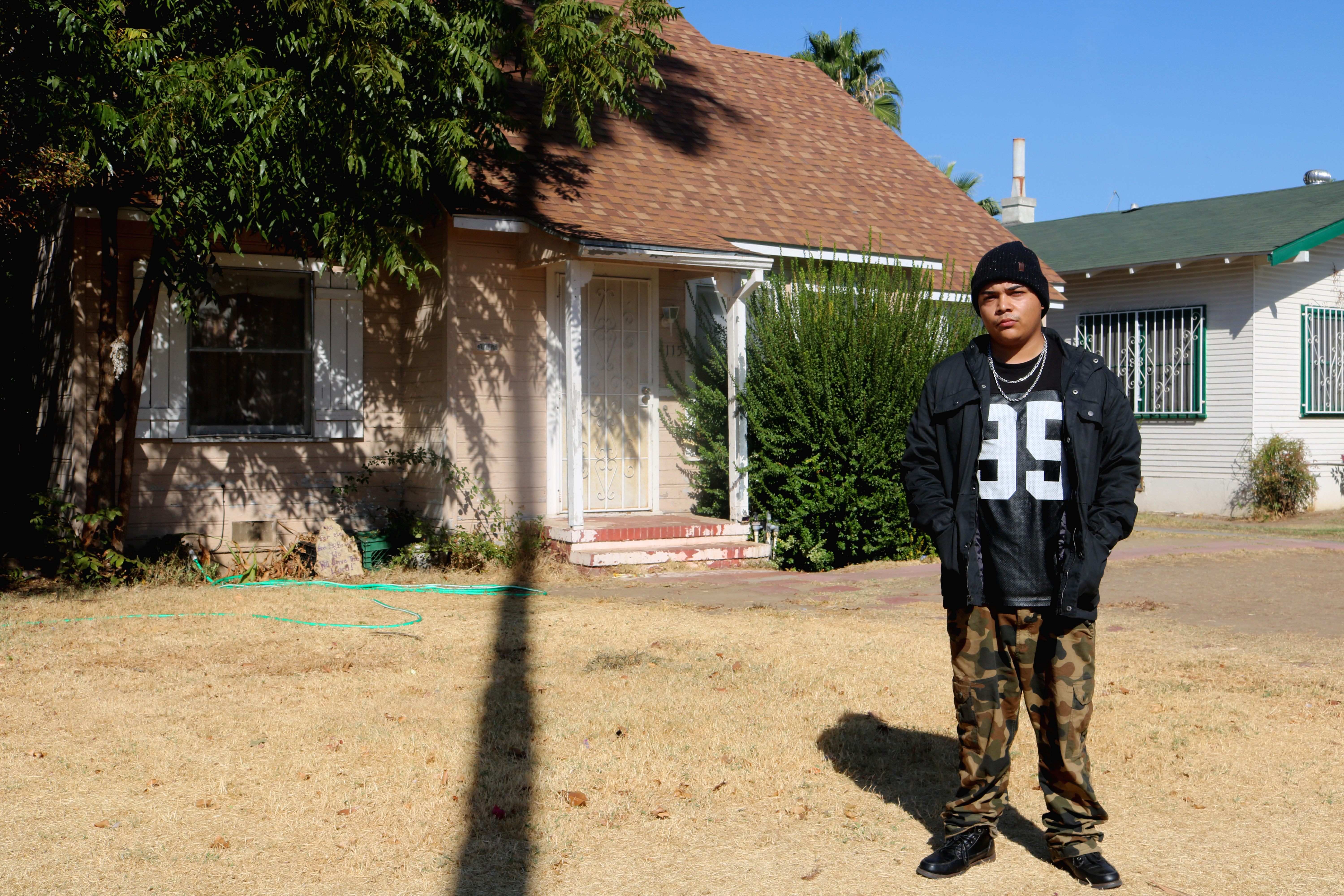 Reyna in front of what is now his Grandmother's home, where he spent the last 9 years of his life. 